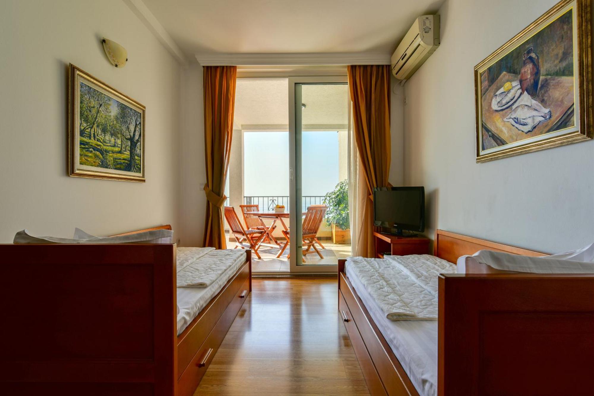 Apartments Leut Ilha Sveti Stefan Quarto foto