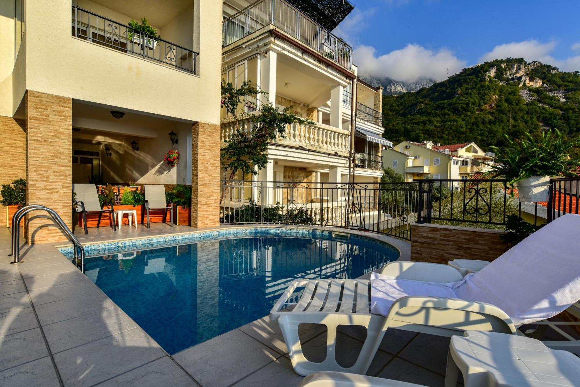 Apartments Leut Ilha Sveti Stefan Quarto foto